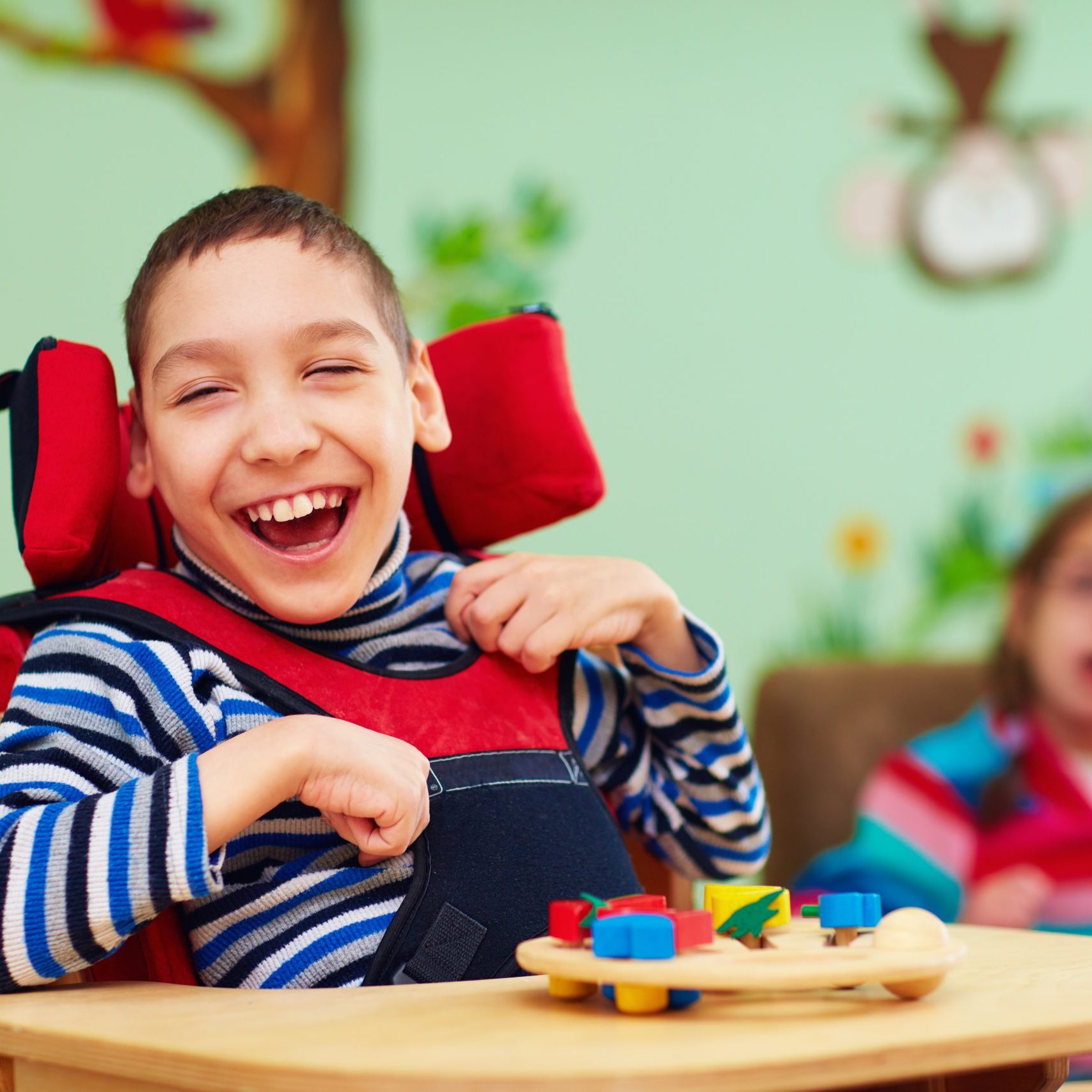 Cheerful,Boy,With,Disability,At,Rehabilitation,Center,For,Kids,With